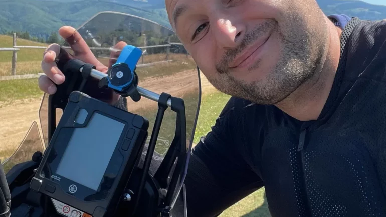 Dragos with his adventure motorcycle in the mountains
