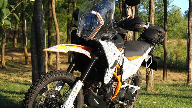 KTM 390 Adventure R parked among trees