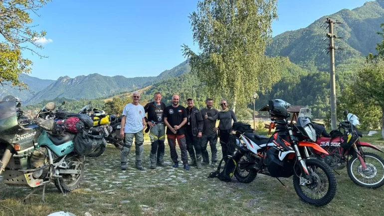 Group of adventure riders with their motorcycles in the mountains